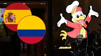 Restaurante Frisby en Bogotá el 14 de mayo de 2025 con banderas de España y Colombia. Frisby España presenta recurso de apelación en contra de la marca colombiana y abriría estos restaurantes
